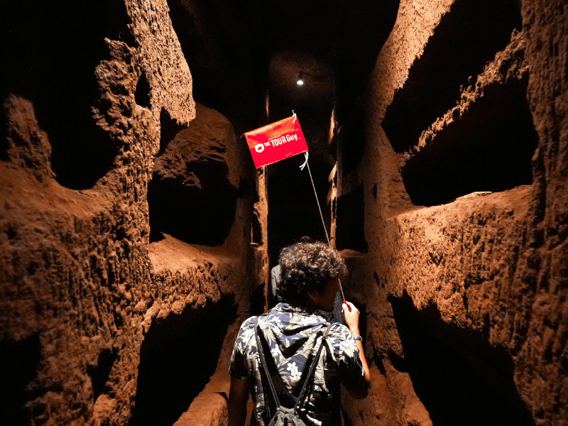 An image of a tour walking through the Catacombs in Rome while on tour with The Tour Guy.