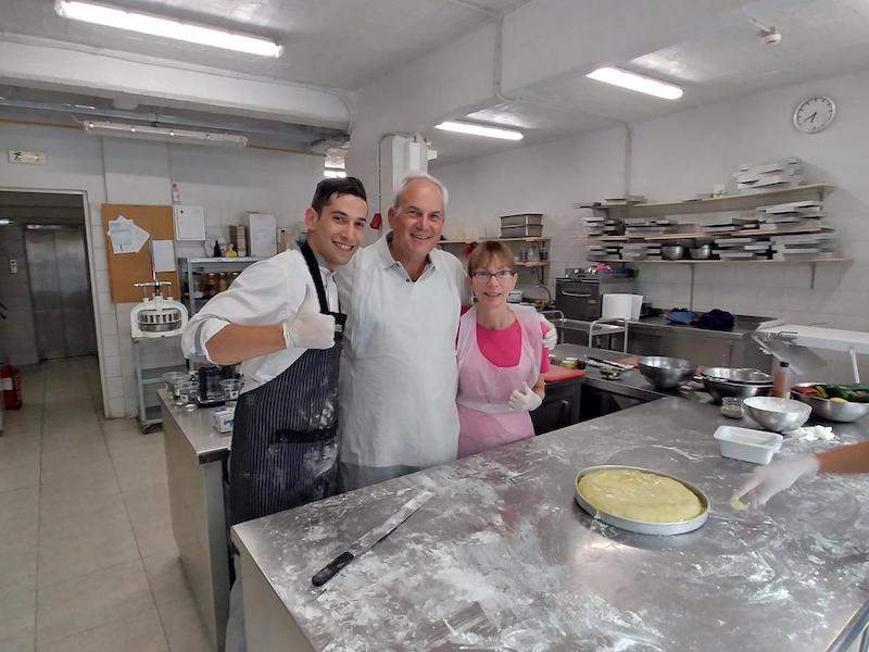 Happy instructor and participants in cooking class