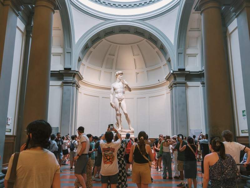 An image of the Statue of David inside the Accademia Gallery.