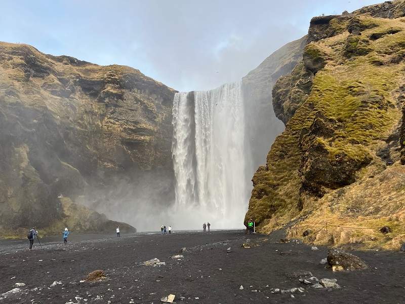 people at skogafoss waterfall