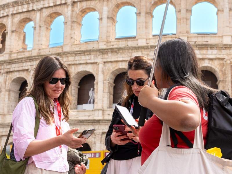 A group of tourists checking in to their Colosseum tour with The Tour Guy.