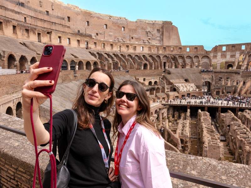 Two women taking a selfie from the 2nd level of the Colosseum while on tour with The Tour Guy.