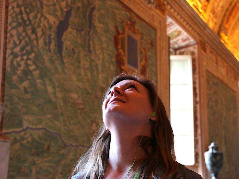 A tourist inside the Hall of Maps.