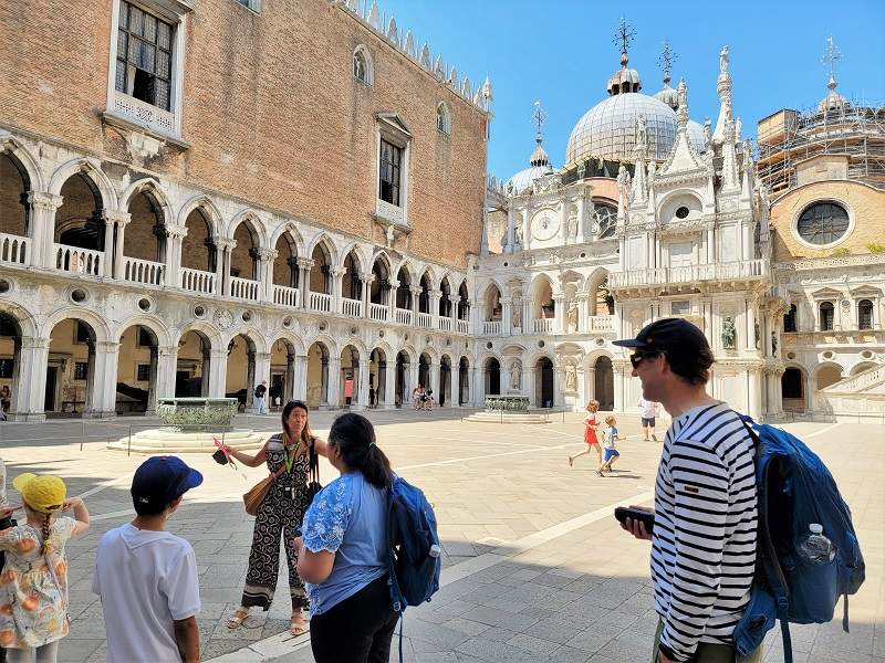 people taking photos in courtyard