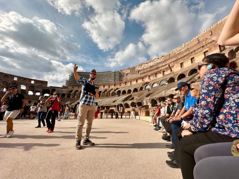 The Tour Guy tour guide and tour group at the Colosseum on the Arena Floor