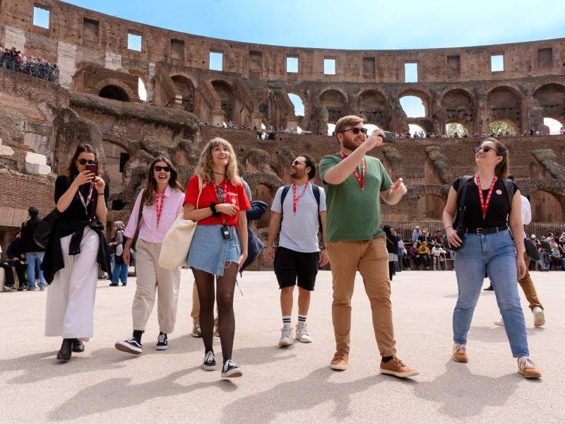 A group of tourists walking through the Arena Floor of the Colosseum with their guide from The Tour Guy,