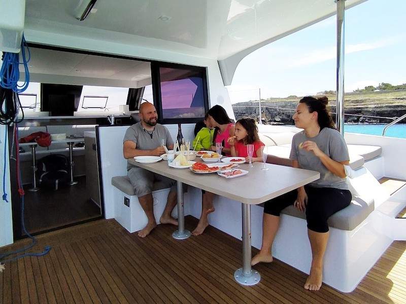 family eating on boat