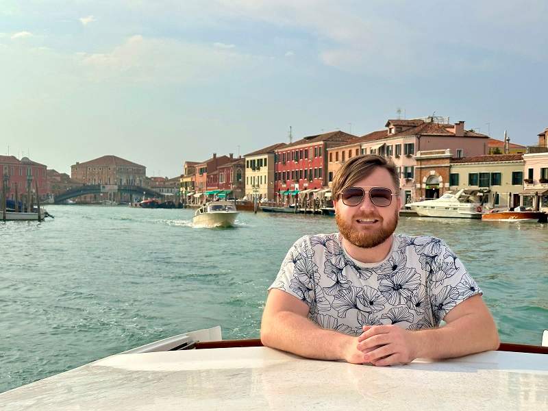 family taking selfie on venice canal