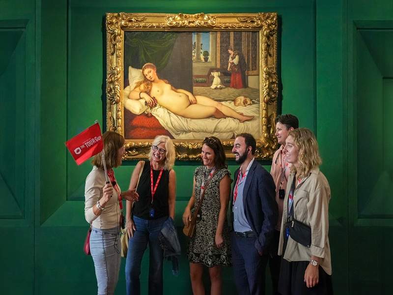 A group of tourists in front of the Venus of Urbino in the Uffizi Gallery while on tour with The Tour Guy.