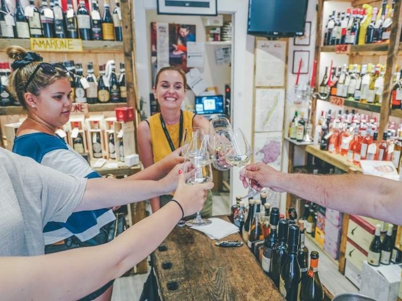 People cheering drinking wine