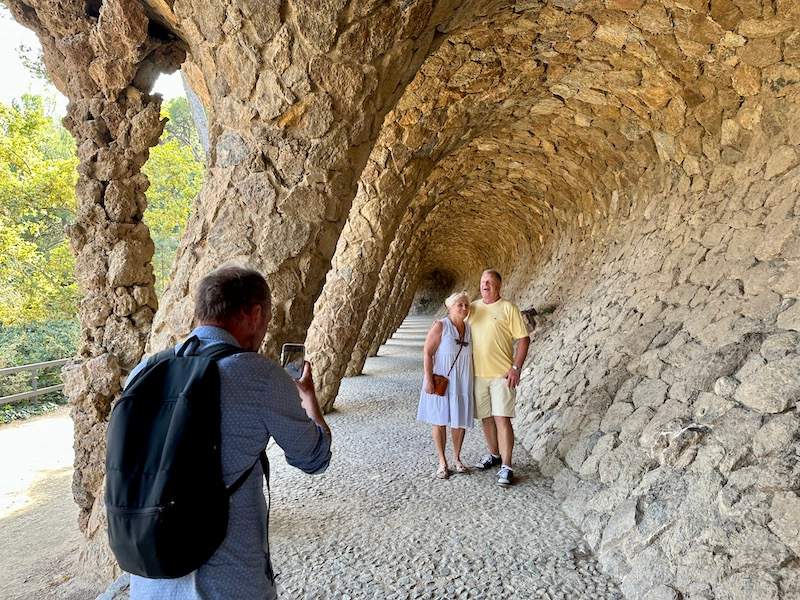 A couple having their picture taken in Parc Guell by their guide from The Tour Guy.