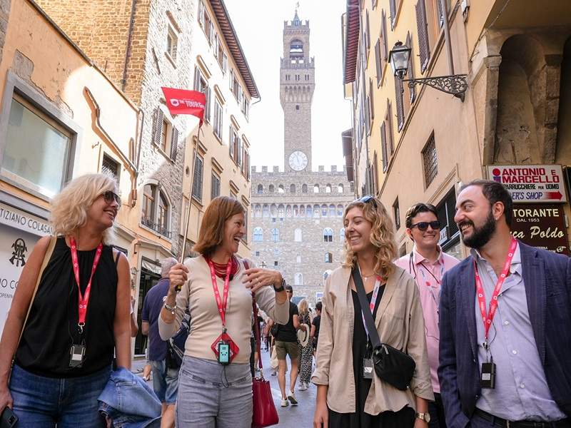 A group of tourists walking through Florence while on tour with The Tour Guy