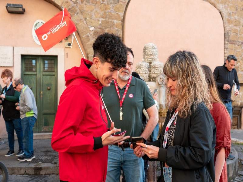 A group of tourists checking in to their tour with The Tour Guy.