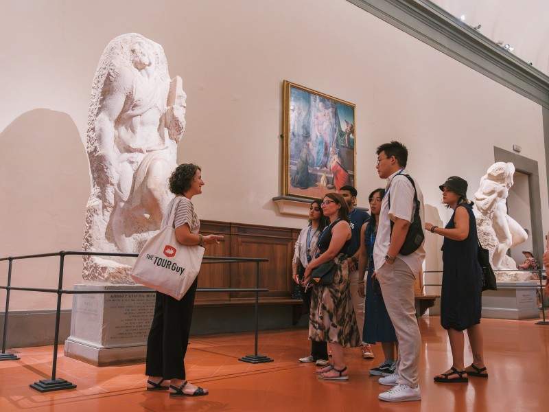 A group of tourists inside the Accademia Gallery while on tour with The Tour Guy.