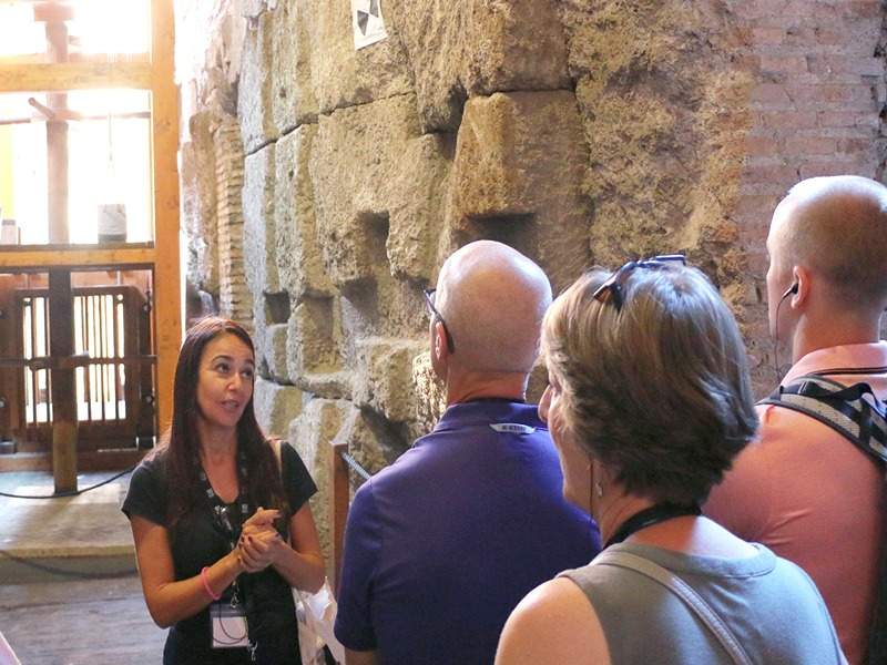 A group of tourists on tour of the Colosseum Underground.