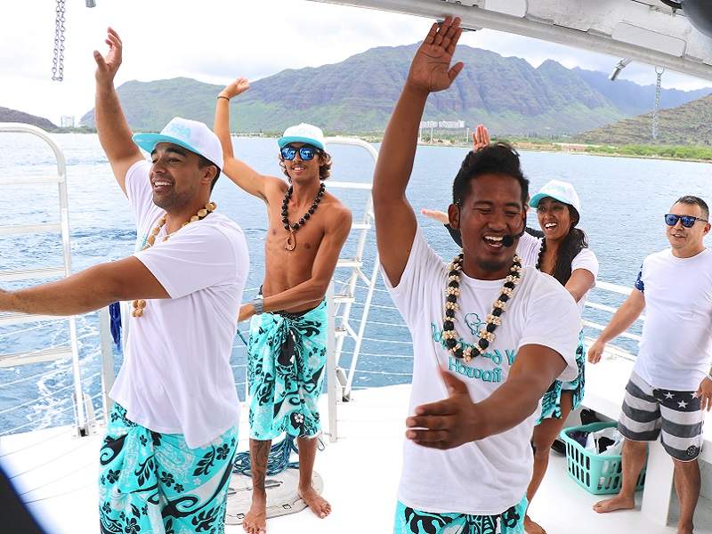 hula instructor teaching people to hula on boat