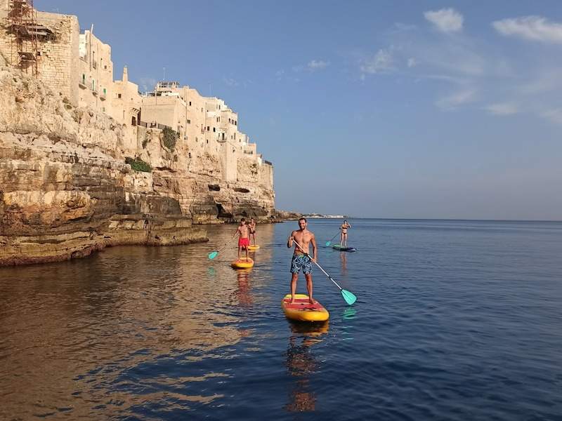 people on paddleboards