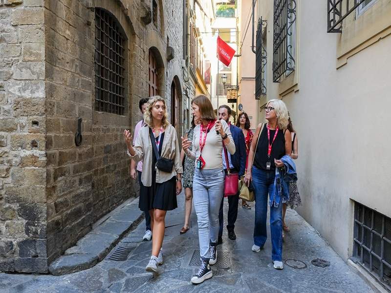 A group of tourists walking through Florence while on tour with The Tour Guy