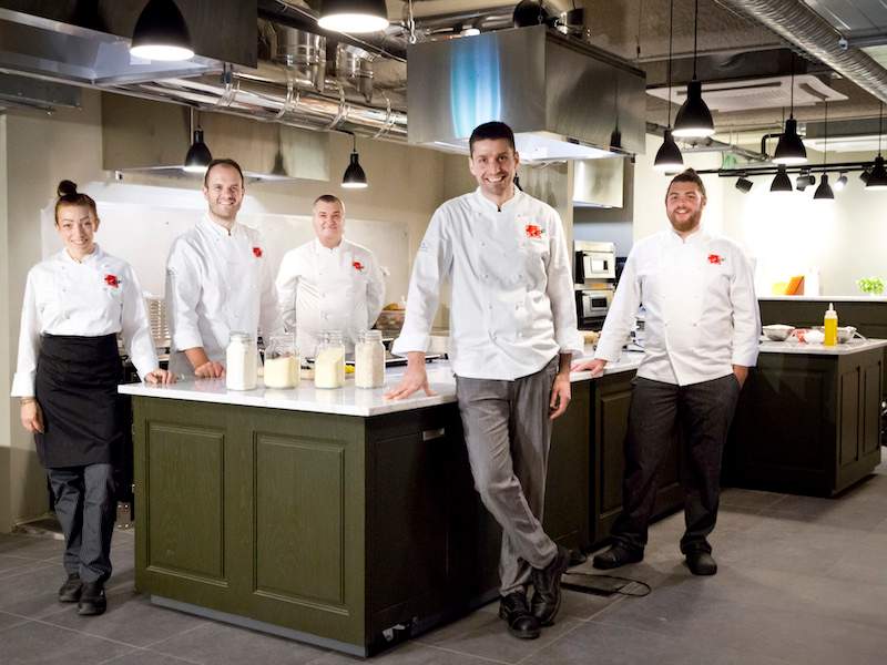 chefs standing in kitchen