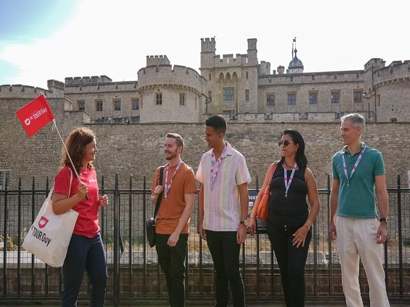 A group of tourists inside the London Tower with their guide from The Tour Guy.