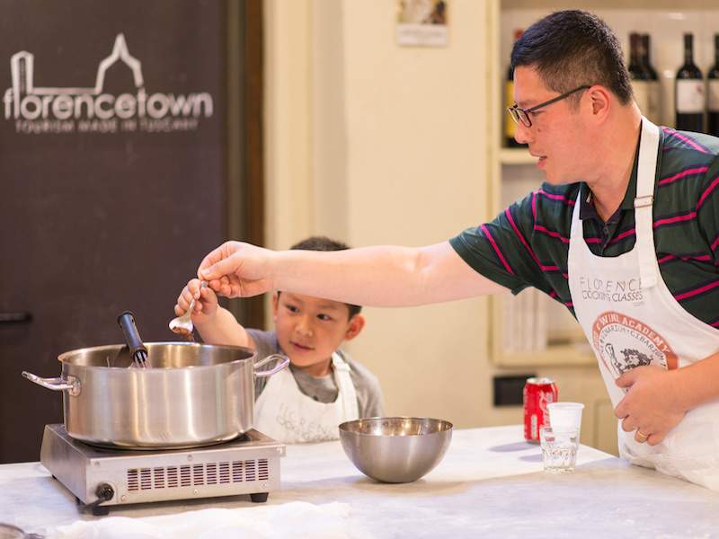 man and boy cooking