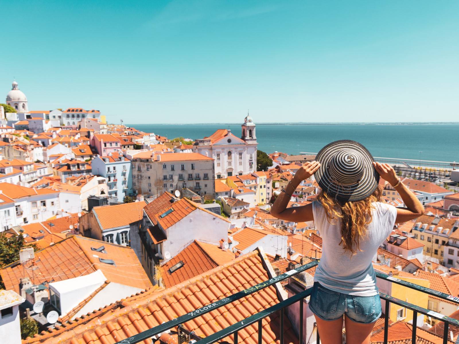 girl looking out to lisbon skyline