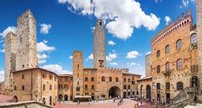 Famous Piazza del Duomo in historic San Gimignano, Tuscany, Italy