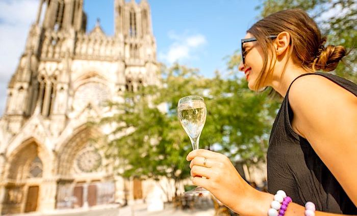 A women drinking champagne on our private day trip from Paris to the Champagne region