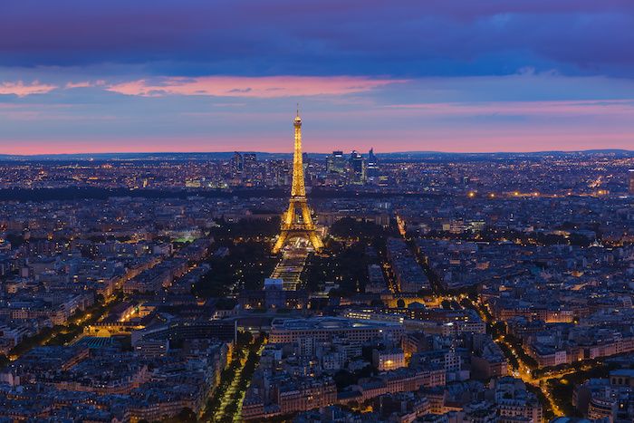 Cityscape of Paris France - Eiffel Tower at night lit up