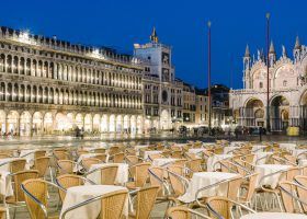 Venice,,Italy,-,Empty,Tables,And,Chairs,In,Piazza,San