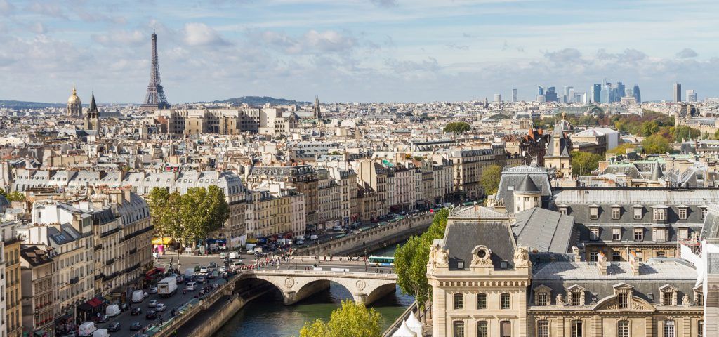 Skyline of Paris with Eiffel tower in the background.