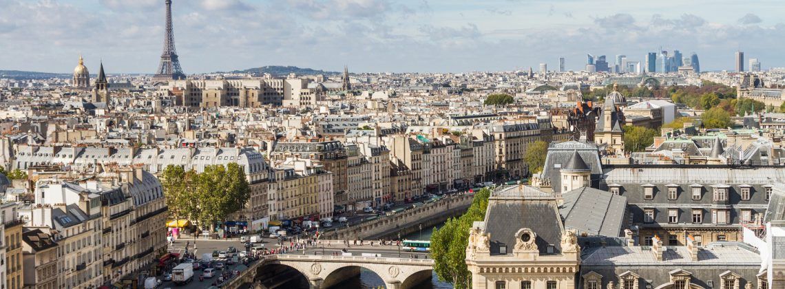 Skyline of Paris with Eiffel tower in the background.