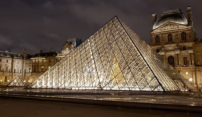 The Louvre Pyramid at night.