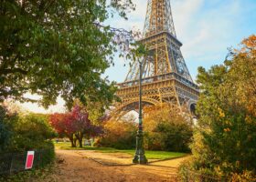 Changes in Travel to Europe in 2026: What You Need to Know Scenic view of the Eiffel tower and Champ de Mars park on a fall day