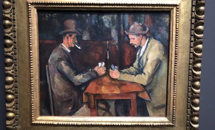 Card Players by Paul Cezanne hanging on the in Musée d'Orsay.