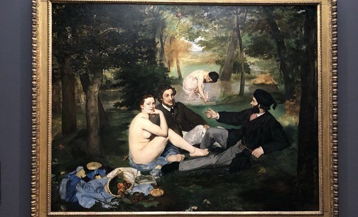 Luncheon Grass By Manet hanging on the wall in Musée d'Orsay.