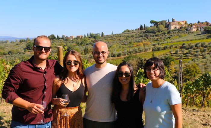 A group pose outside a vineyard on one of our best Florence tours.