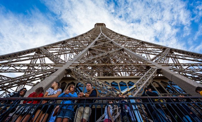 visitors on the Eiffel tower in Paris.