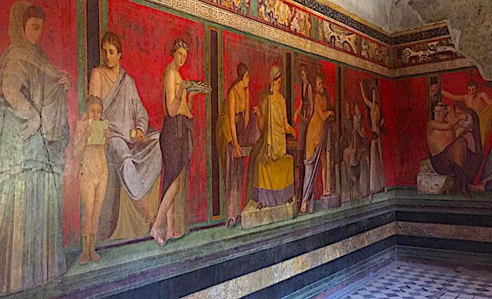 Colourful Roman murals in one of the Pompeii villas