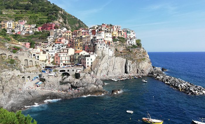 View of the Cinque Terre town of Riomaggiore and the coast.