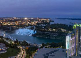 Night aerial view of the Skylon Tower and the beautiful Niagara Falls