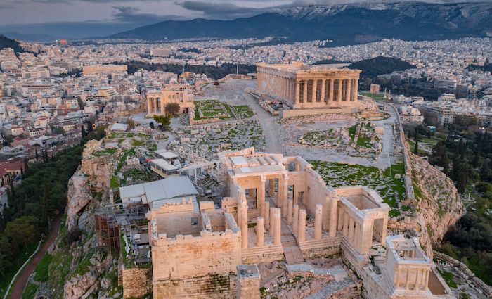 Aerial view of the ancient Acropolis site in Athens with the city and hills in the background