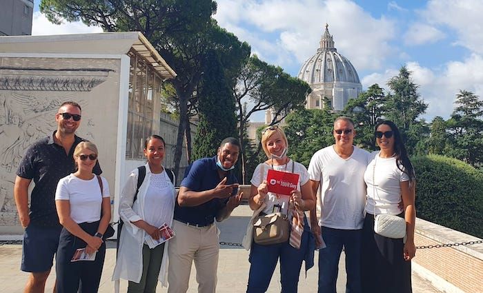 Tour group with their Tour Guy Guide outside of the Vatican Museums in Italy