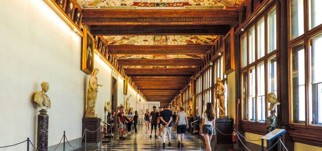 people looking at statues in Uffizi galley