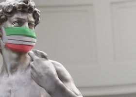 Statue wearing Italy flag mask