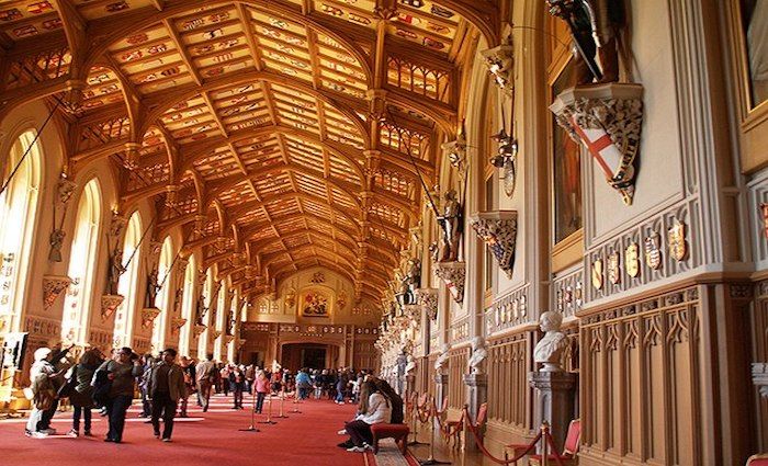 People walking through the impressive St. George's Hall at Windsor Castle