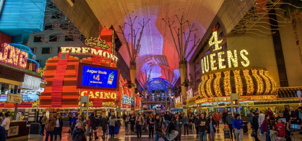 Fremont street with neon signs and a crowd of people