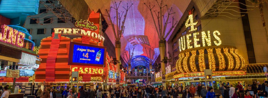 Fremont street with neon signs and a crowd of people
