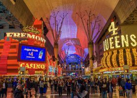 Fremont street with neon signs and a crowd of people