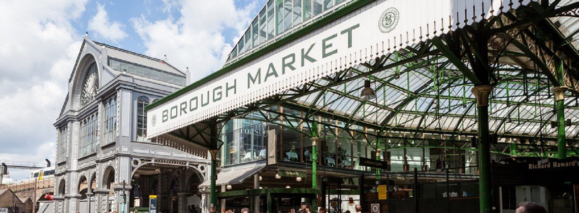 Entrance to Borough market with people.